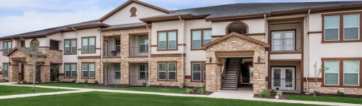 community outdoor area with a dedicated grill space